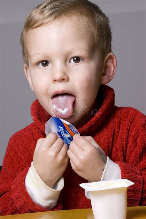 Boy Eating Yogurt Stock Photo Image Of Vertical Spoon 10756506