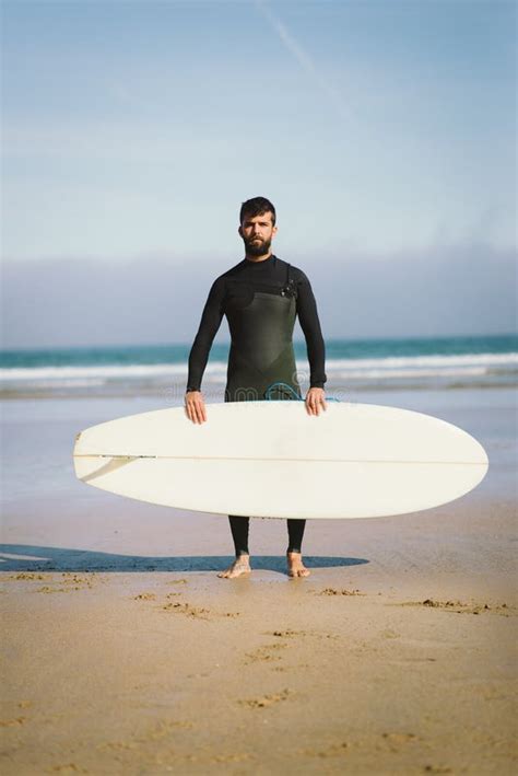 Surfer Holding His Surfboard Against The Sea Stock Image Image Of