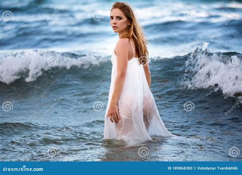 Sensual Woman Outdoors Travel And Adventure Concept Beautiful Woman In Dress On Sea Background