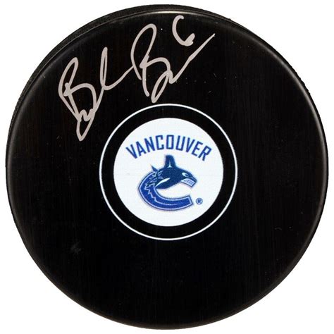 this puck has been personally hand signed by brock boeser it is officially licensed by the