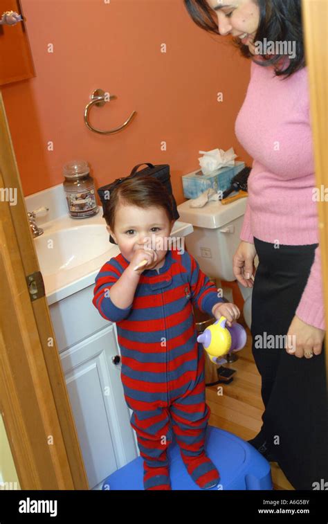 Hispanic S Year Old Mom Is Getting Ready For Work In The Morning Stock Photo Alamy