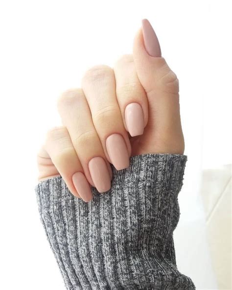 Simple Powder Pink Nude Nails With Squoval Shape On A Hand With