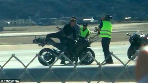 Tom Cruise Rides Motorcycle Around Airfield As Maverick In First