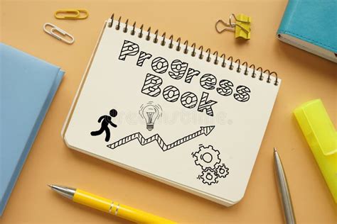 Progress Book Is Shown On The Business Photo Using The Text Stock Photo
