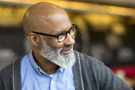 Portrait Of Bald African American Man With Grey Beard Wearing Glasses