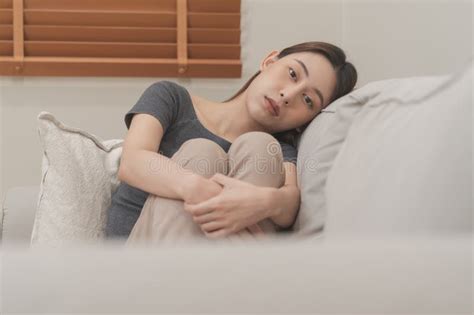 Mental Health Depressed Sad Asian Young Woman Girl Sitting On Sofa