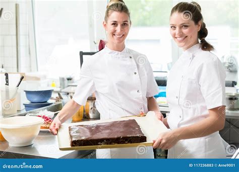 Confectioners Or Pastry Makers Baking Pies And Cakes Stock Image