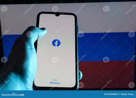 Facebook Application On Smartphone Russian Flag In Background