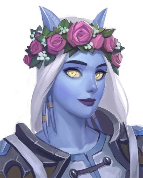 an avatar with flowers in her hair and blue skin wearing a costume that looks like she