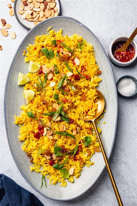 Turmeric Rice With Quick Pickled Golden Raisins And Toasted Almonds