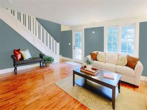If you have light wooden floors you can continue the wood theme with light beige or brown walls. Gray Paint Color for Living Room with Wood Floor | Blue ...