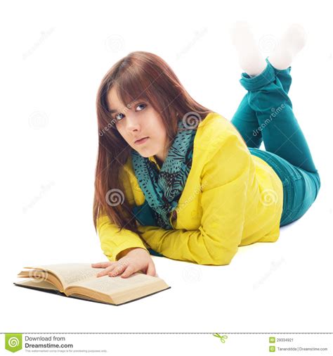 Portrait Of A Teenager Lying On The Floor Reading Book Stock Image