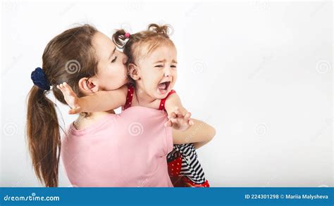 Mother Holds And Soothes Crying Small Baby Girl Mom And Daughter Stock