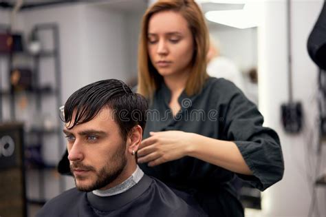 Handsome Blue Eyed Man Sitting In Barber Shop Hairstylist Hairdresser