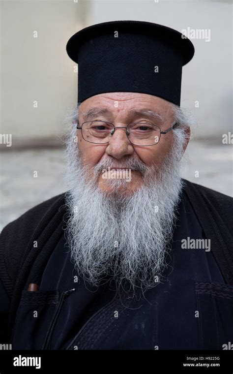 Portrait Of A Greek Orthodox Priest Wearing A Kalimavkion Stock Photo