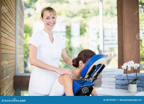Smiling Physiotherapist Giving Shoulder Massage To Woman Stock Image Image Of Professional