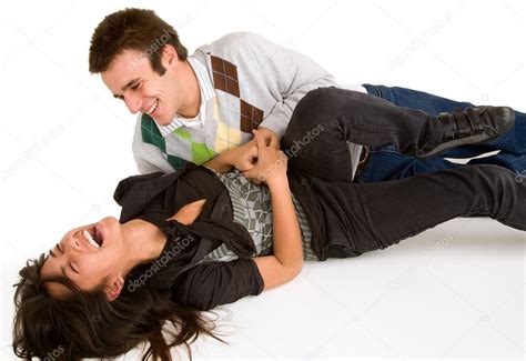 Young Girl Being Tickled By Young Man Stock Photo By ©cybernesco 2387674