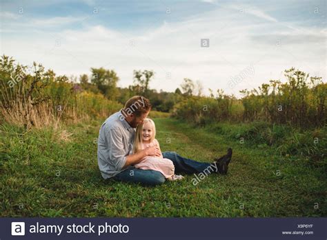 Daughter Sitting On Fathers Lap High Resolution Stock Photography And