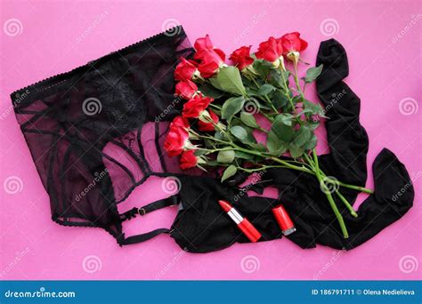 sexy belt with stockings and red roses red lipstick on pink background top view cartoondealer