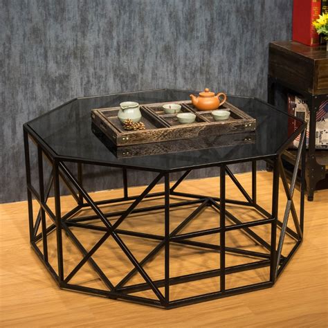 The top material of the table is a round glass top with a brown rust finish, fitted directly onto the metal base. American small tea table coffee wrought iron a few simple ...