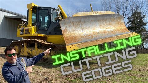 Installing cutting edges on the Komatsu D65 Dozer. - YouTube