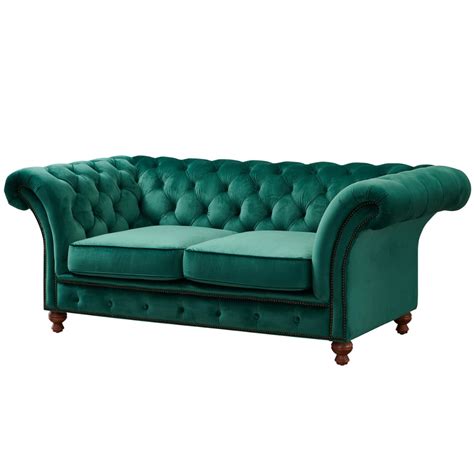 A Green Velvet Chesterfield Sofa With Wooden Legs