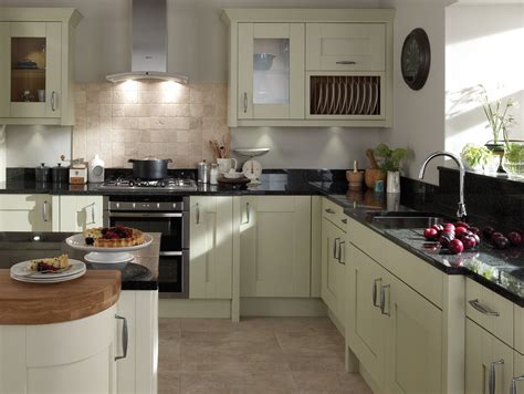Kitchens with white cabinets and yellow walls. Milbourne Sage from Eaton Kitchen Designs Wolverhampton