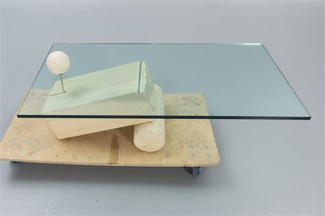 A Glass And Travertine Coffee Table Later Part Of The 20th Century Bukowskis