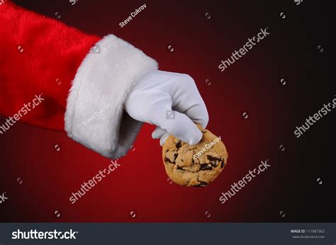 Santa Claus Hand Holding Chocolate Chip Stock Photo 111987362