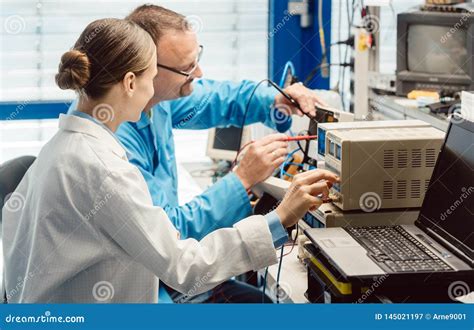 Team Of Electronic Engineers Testing A Product Prototype Stock Image