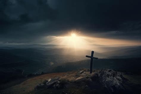 丘の上に十字架のある風景太陽光線と雲イースターのコンセプトとキリストの磔刑 ai プレミアム写真