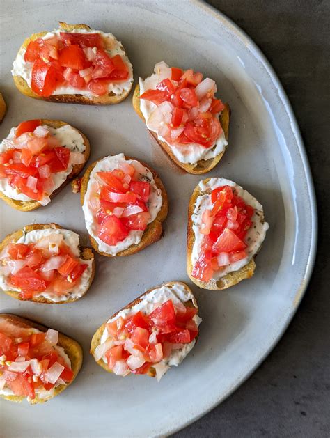 Tomato Bruschetta With Crostini And Garlic And Herb Cheese The Candid Cooks