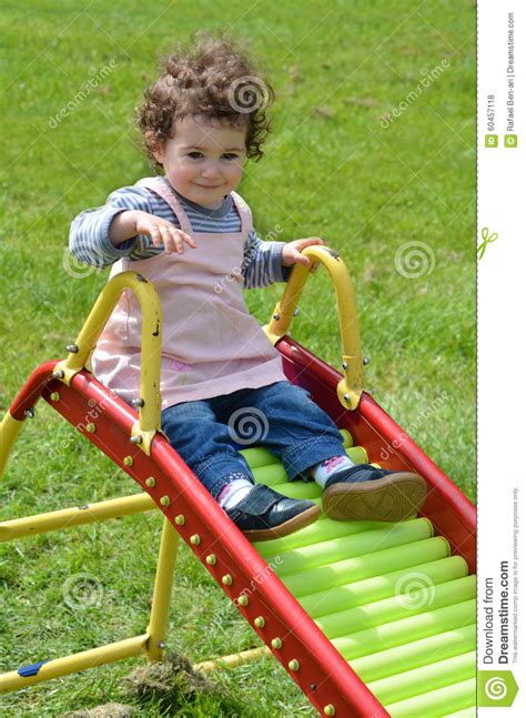 Little Child Sliding On A Slide Stock Photo Image Of Outside