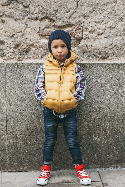 Little Hipster Boy Standing On Wall By Stocksy Contributor