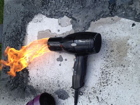 Photo Of A Hair Dryer Shooting Flames During An Electrical Fire