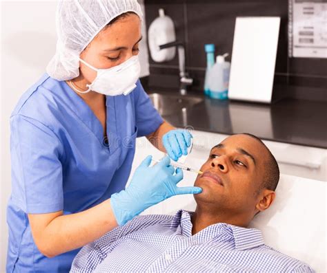 Male Client During Face Mesotherapy In Cosmetology Clinic Stock Image