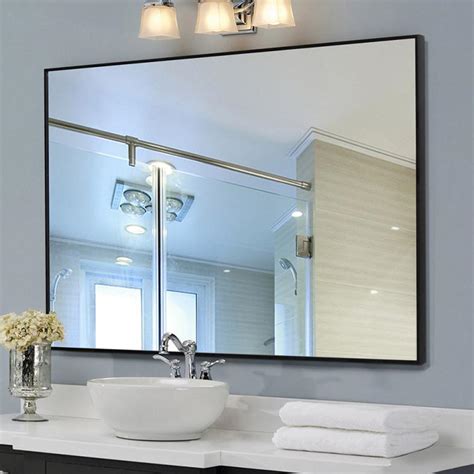 Framed by round sconces, this unassuming mirror also perfectly accents the black vanity and white marble countertop. Rectangle Black Framed Bathroom Vanity Mirror DFS-01 ...