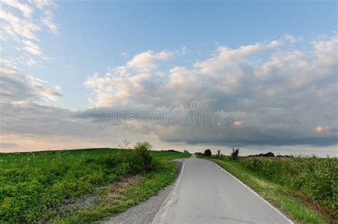 Country Road Through The Green Fields Stock Image Image Of Scenic