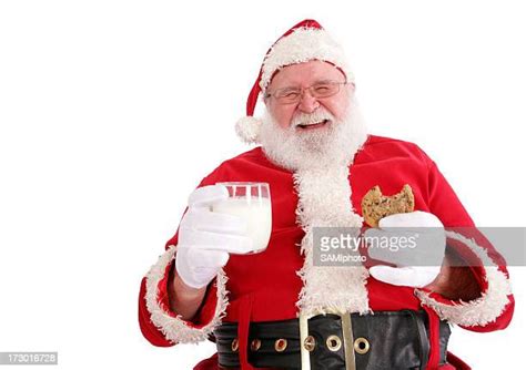 Santa Eating Cookies Photos And Premium High Res Pictures Getty Images