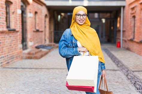 Sale And Buying Concept Happy Arab Muslim Girl With Shopping Bags After Mall Stock Image