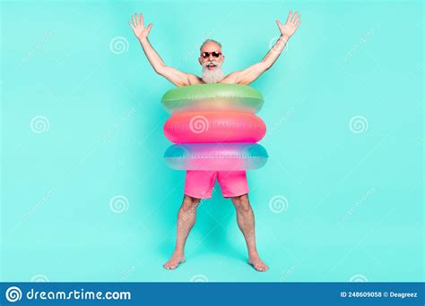 Photo Of Crazy Old Man Enjoy Fun Raise Hands Wear Lifebuoy Sunglass