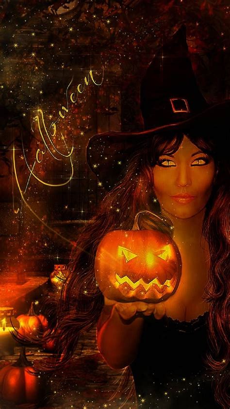 A Woman Wearing A Witches Hat Holding A Pumpkin
