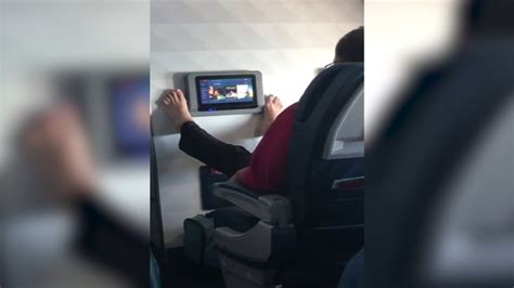 Viral Video Shows Airline Passenger Use Feet To Swipe Through In Flight