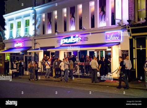 People Gathered Outside Nightclubs And Bars In Norwich Uk Stock Photo