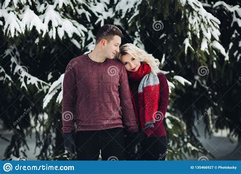 Blonde Wife Leaning On Shoulder Her Husband At Winter Forest Stock