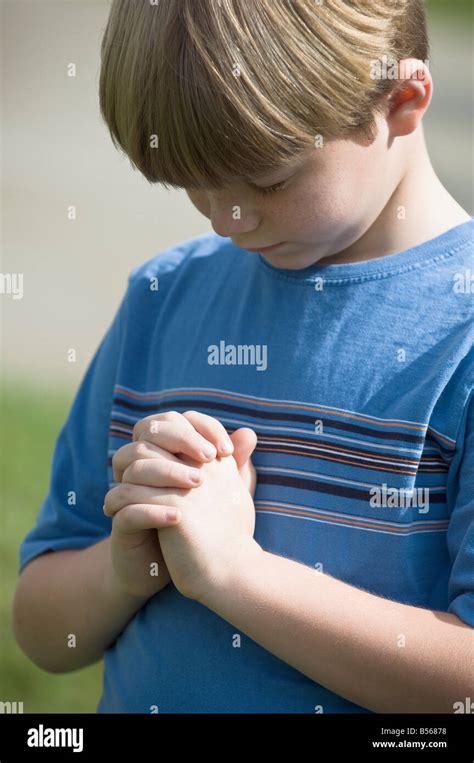 Young Boy Praying Stock Photo Alamy