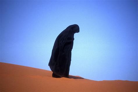 Muslim Woman Praying On A Sand Dune Photo Photograph By