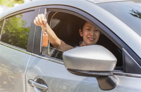 Woman Holding A Car Key In Her Hand While Sitting In Her Car Stock Image Image Of Automobile