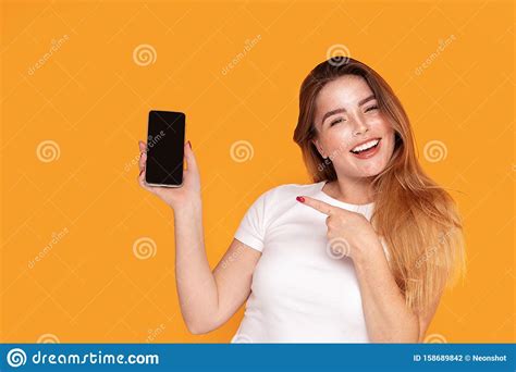 Smiling Girl Showing Mobile Phone With Empty Screen Stock Photo - Image ...