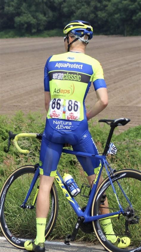 A Bicyclist In Blue And Yellow Riding His Bike